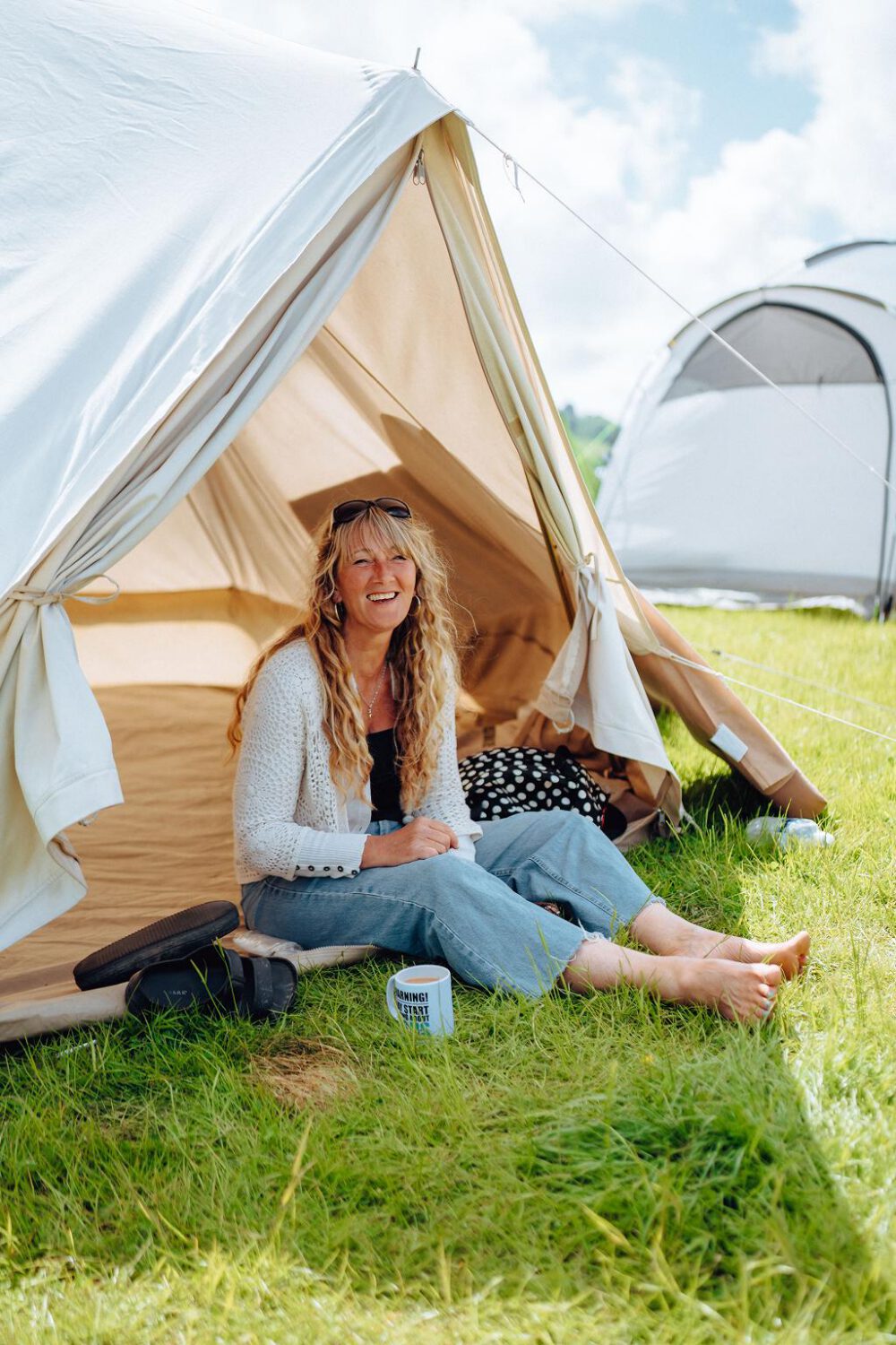 lady sitting outside glamping tent